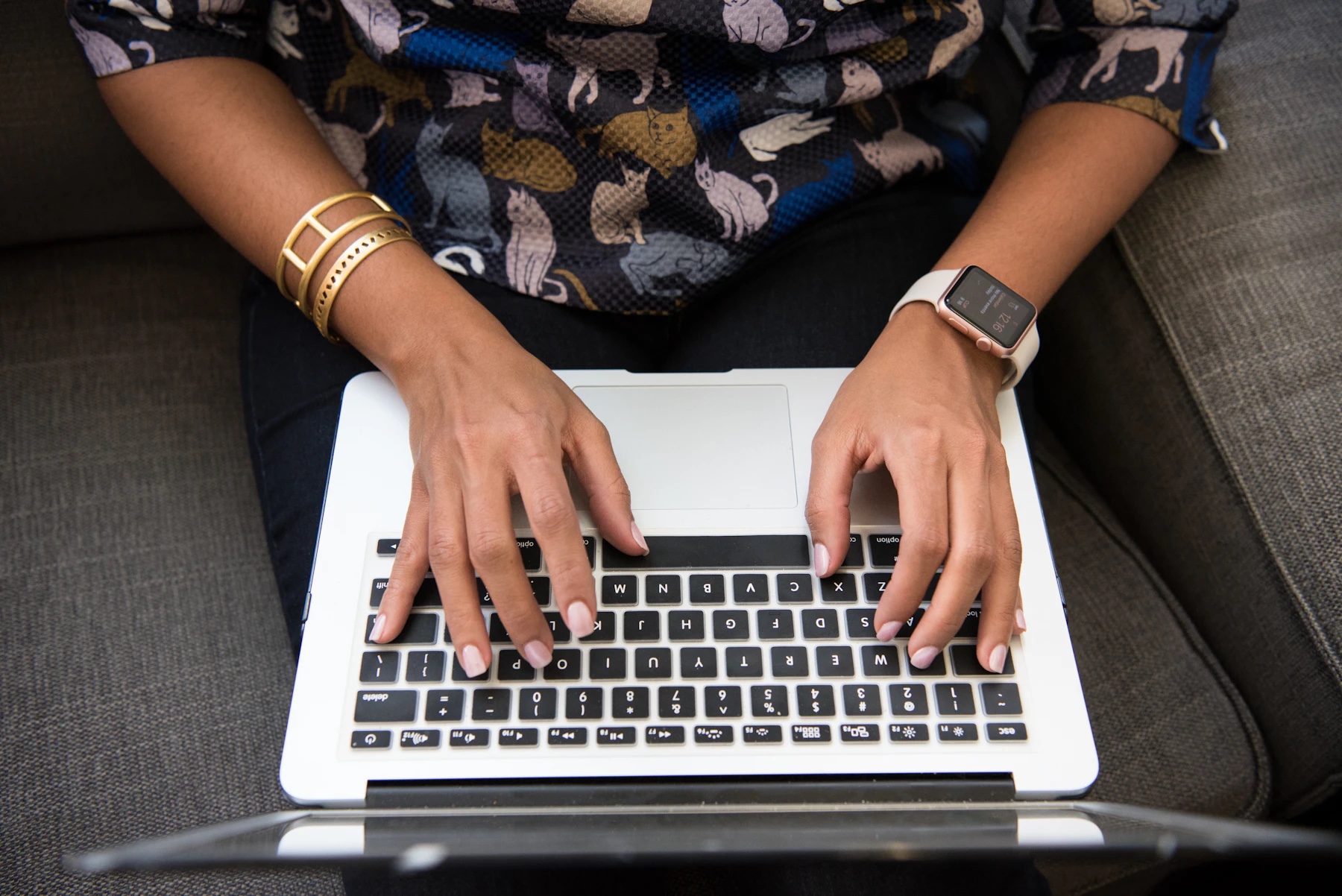 A designer working independently on a laptop.